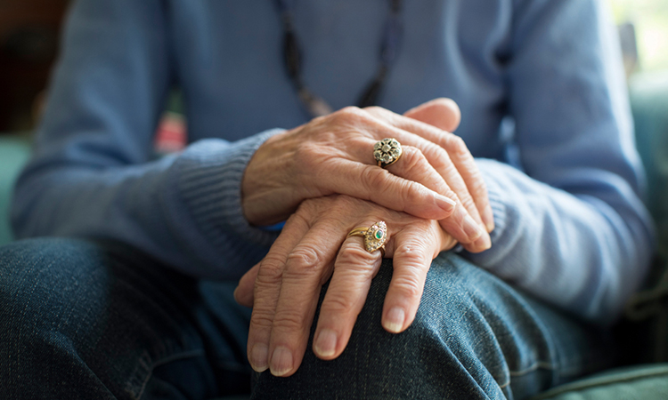 Close Up Of Senior person Suffering With Parkinsons Diesease