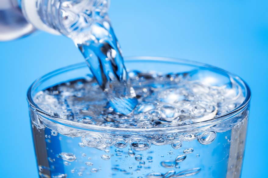 pouring a glass of sparkling water