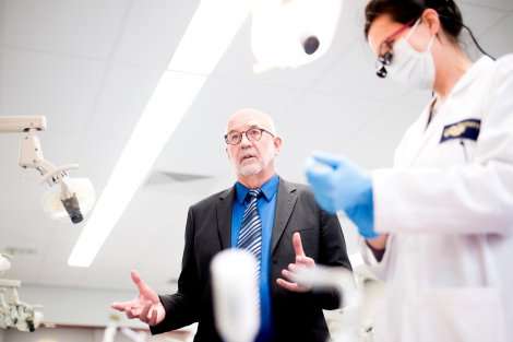 John Featherstone (center), PhD, dean of the School of Dentistry, helped to develop the CAMBRA approach in the early 2000s. Credit: Noah Berger