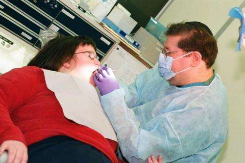 Evan Spivack works on a patient at the Rutgers School of Dental Medicine's special care center. Credit: Rutgers School of Dental Medicine