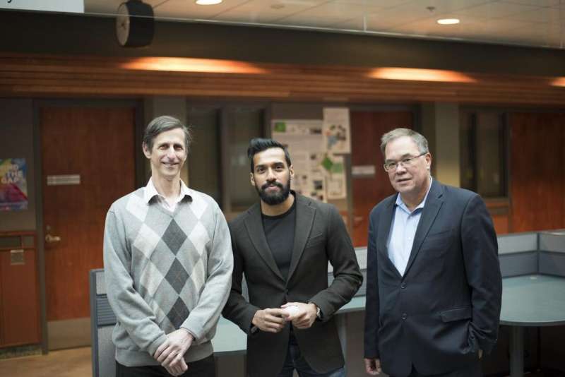 Sunil Kalmady Vasu (centre) led a recent study with fellow U of A researchers including Russ Greiner (left), Andrew Greenshaw (right) and Serdar Dursun (not pictured), showing that a machine learning tool could help predict early symptoms of schizophrenia in siblings and children of patients, potentially leading to earlier diagnosis and treatment. Credit: University of Alberta (taken pre-COVID-19)