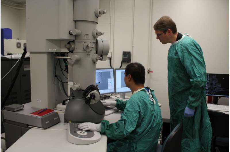 Holger Wille (right) and a team member use electron cryomicroscopy technology to study the infectious prion protein. Credit: Melissa Fabrizio