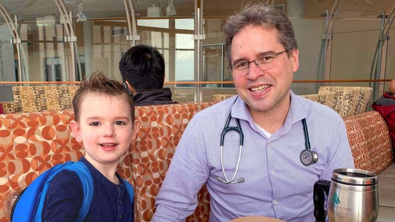 U of A researcher Simon Urschel with patient George Kemp, who received a heart transplant as a baby and is now four years old. Credit: Lindsey Kemp; taken pre-COVID-19