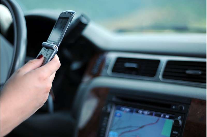 Research urges police to consider dangers of drivers using their phones hands-free, as well as handheld 