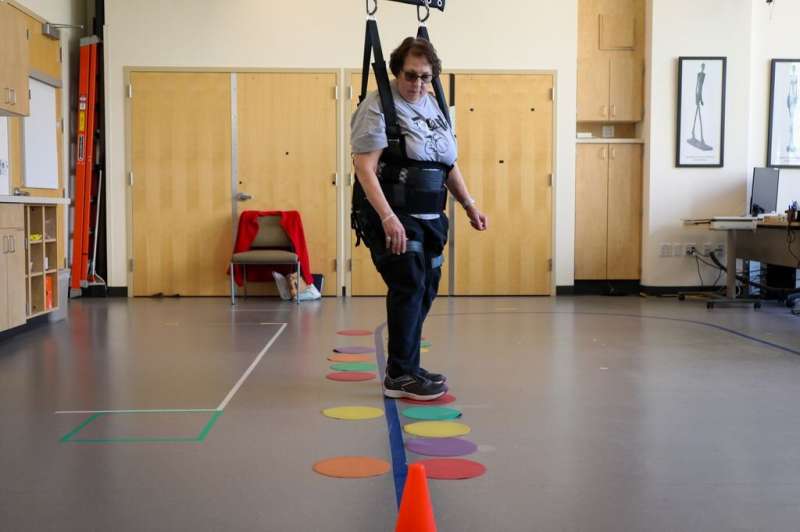 Linda Cherney demonstrates an OHSU training protocol designed to improve the ability to turn for people with Parkinson’s disease. An OHSU clinical trial is using wearable sensors to test whether the training improves mobility and quality of life. Credit: OHSU/Christine Torres Hicks