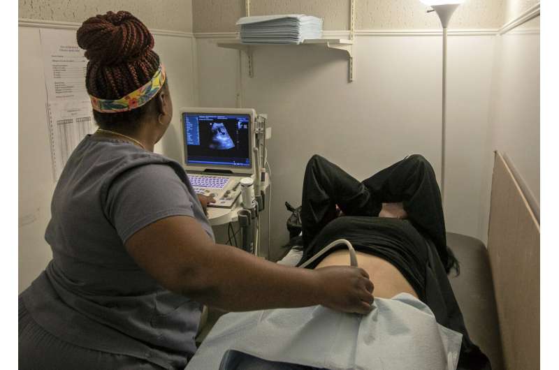 An operating room technician performs an ultrasound on a patient at Hope Medical Group for Women in Shreveport, La., on July 6, 2022. Doctors in states with strict abortion restrictions say an increasing number of pregnant women are seeking early prenatal testing, hoping to detect serious problems while they still have time to choose whether to continue the pregnancy. Credit: AP Photo/Ted Jackson, File