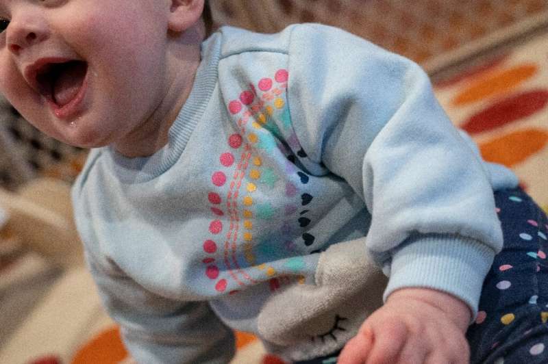 An 11-month-old baby plays with a teething toy on January 20, 2022 in Washington, DC