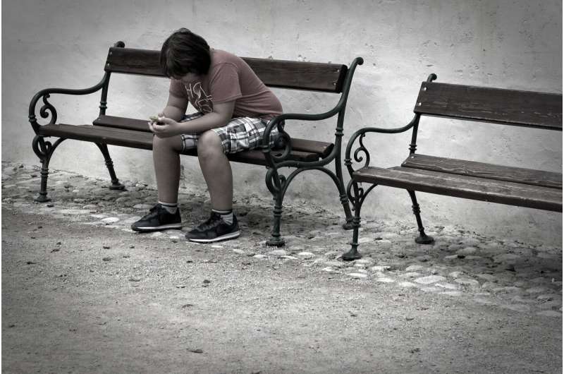 teen sitting alone