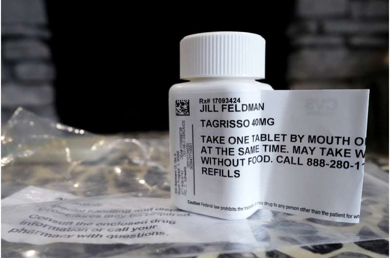 A prescription bottle named osimertinib (brand name: Tagrisso) is seen on a table at Jill Feldman's home in Deerfield, Ill., Friday, Jan. 19, 2024. Lung cancer patient and advocate Jill Feldman takes pills at home that shrink tumors by blocking a signal that tells cancer cells to grow. Credit: AP Photo/Nam Y. Huh