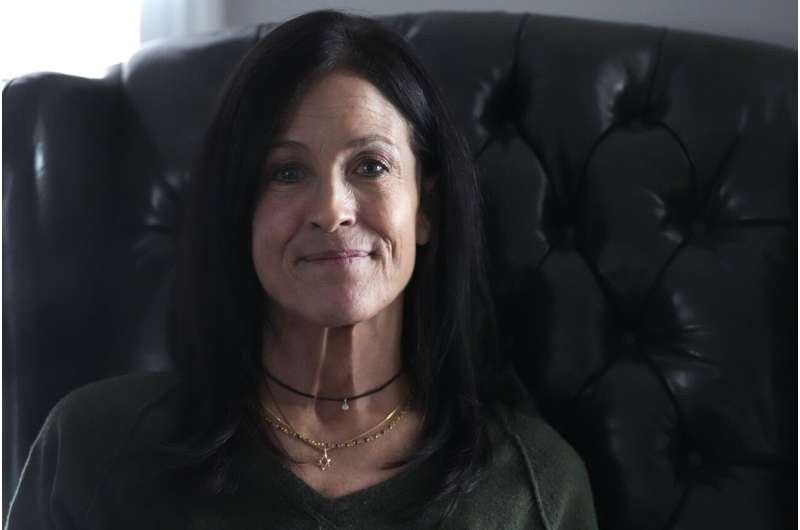 Jill Feldman, 54, poses for a photo at her home in Deerfield, Ill., Friday, Jan. 19, 2024. Lung cancer patient and advocate Jill Feldman takes pills at home that shrink tumors by blocking a signal that tells cancer cells to grow. Credit: AP Photo/Nam Y. Huh