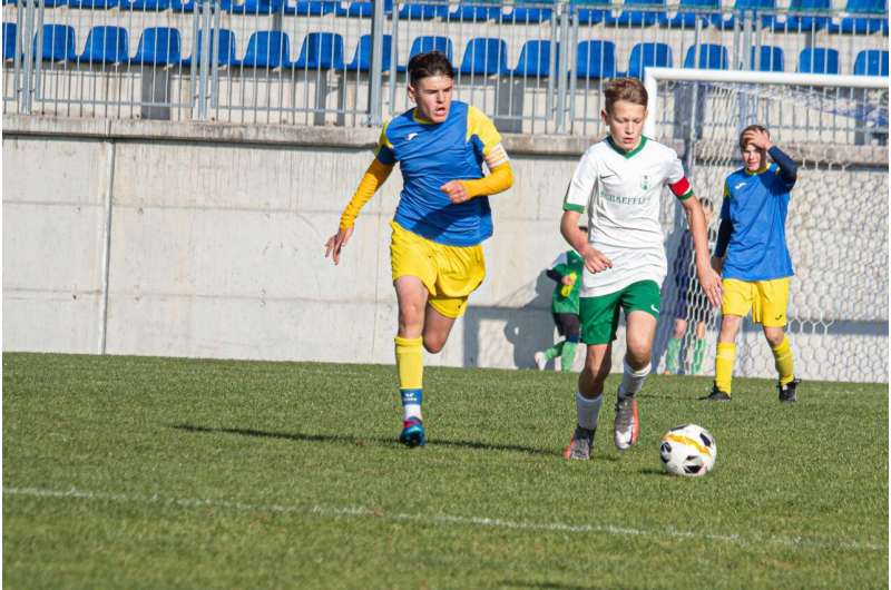 children playing soccer